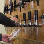 A close up of a beer being poured at the Steel City Beer And Cider Festival.