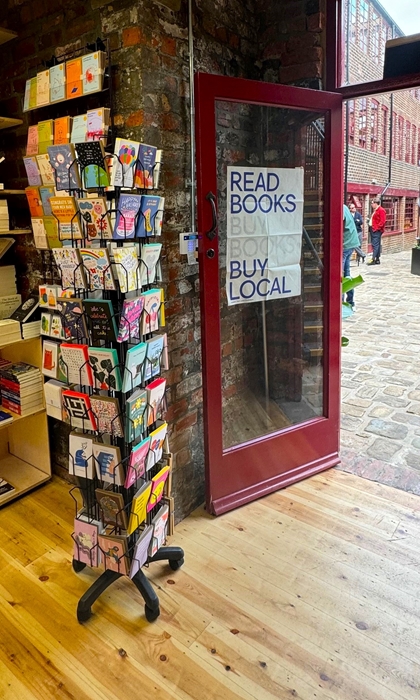The door to La Biblioteka book shop opening out into Leah'd Yard
