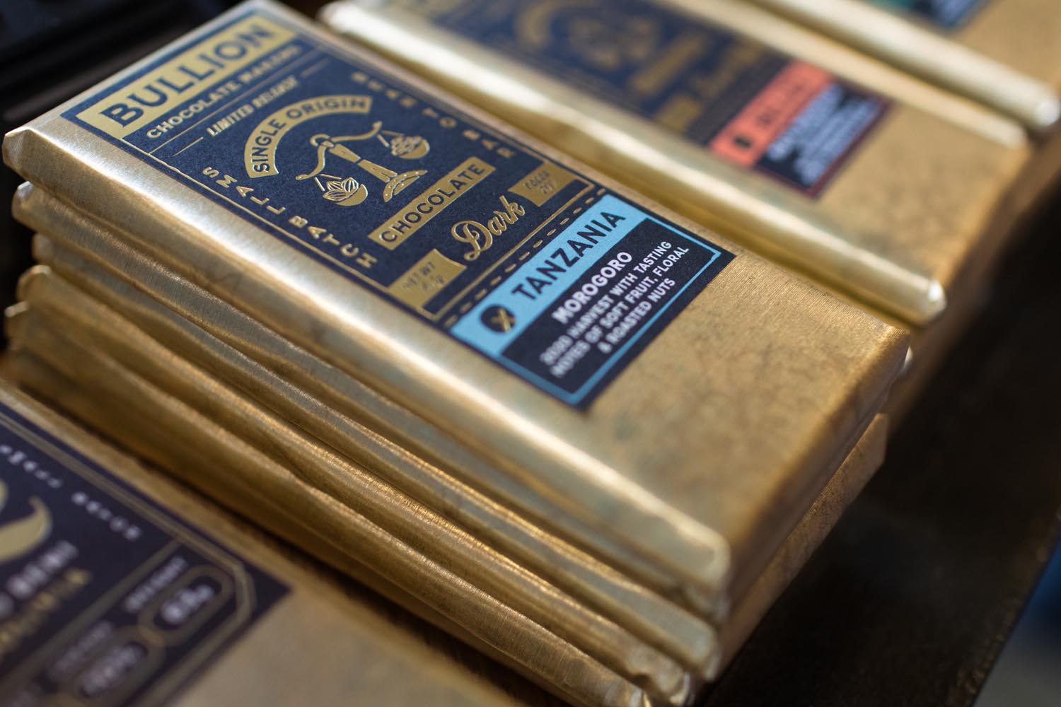 A close-up of bars of Bullion chocolate stacked up on a display.