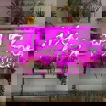 A table and chairs in a cafe. Above them, on the wall, is a bright pink neon sign that reads 'Wild Things'.