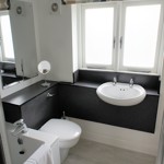 Bathroom with a sink, toilet, and shower or bathtub