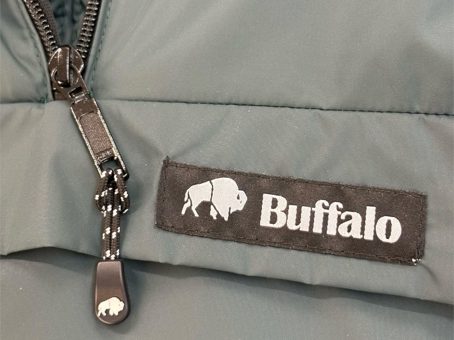 Logo details on a Buffalo Systems jacket.