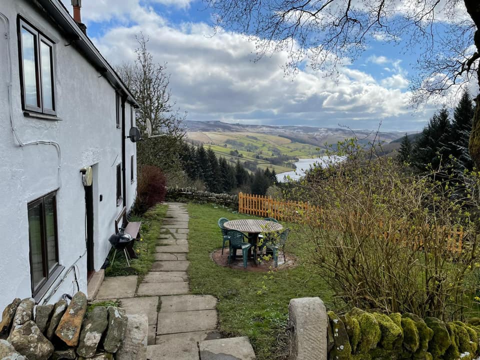 A building, in the countryside, overlooking a valley.
