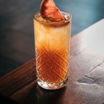 A cocktail in a tall glass.