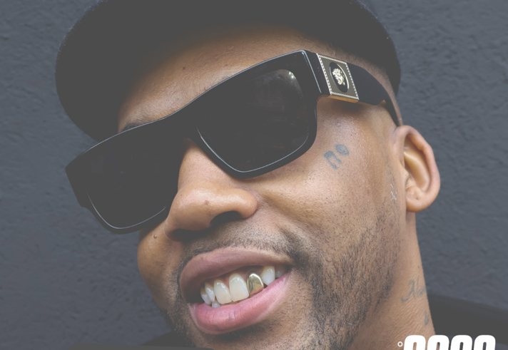 Poster for the event with a close up of a person's head. They are wearing sunglasses and a baseball hat.