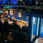 People eating at tables at The Wildcard Bar & Grill.