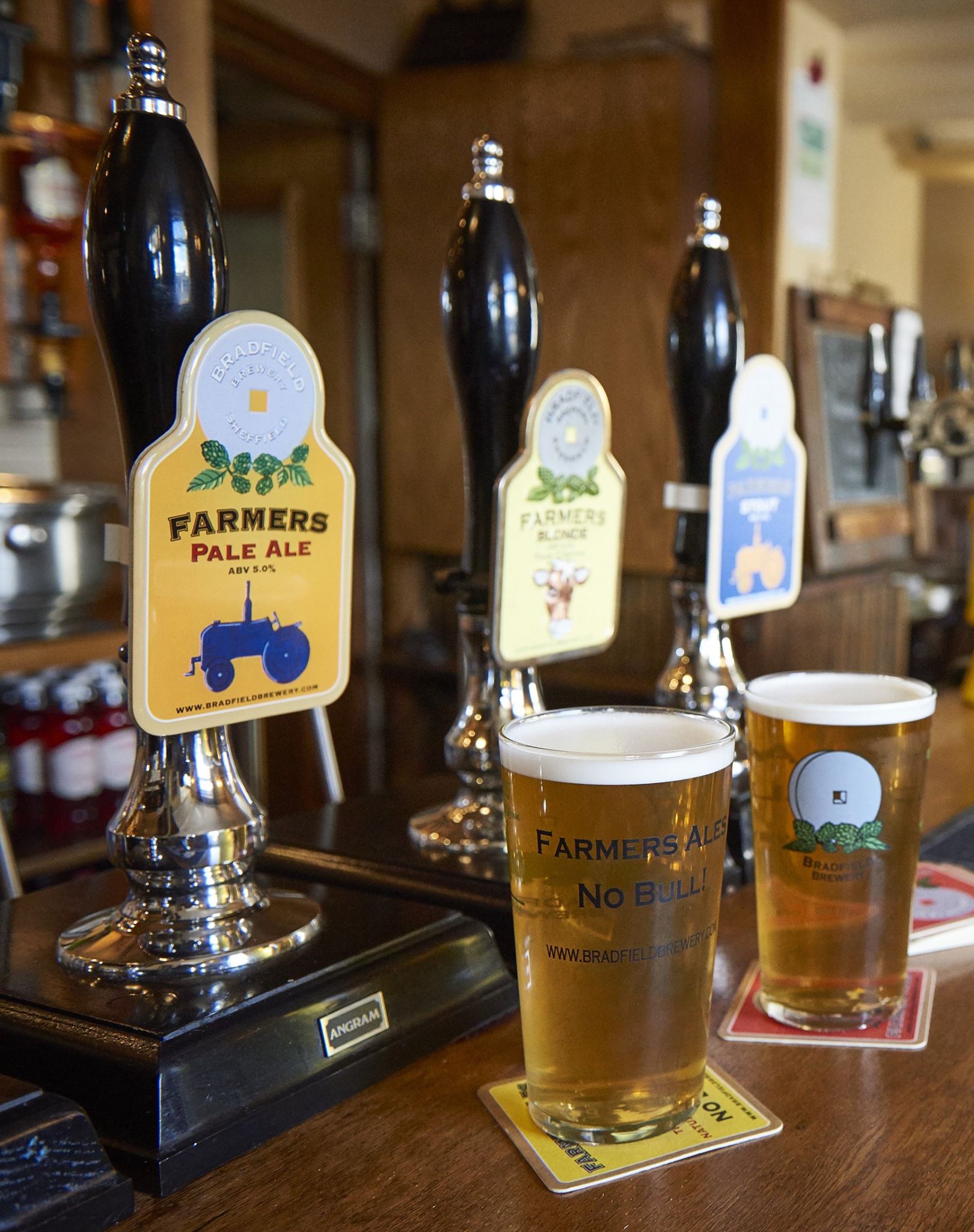 Two pints of beer on the bar at The Nags Head Inn.