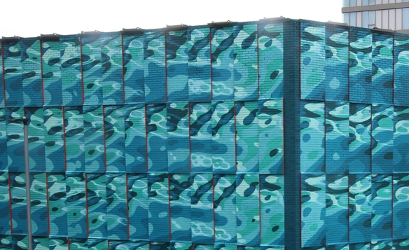 A close up view of INSA's Rivers street art showing the corner of the building 