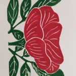 A linocut-style print showing a large red flower with smooth, rounded petals marked by white carved lines. The flower is surrounded by multiple green leaves with white vein details, all set against a plain background.