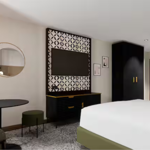 Modern bedroom with TV on wall at the Doubletree by Hilton Sheffield City