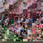 A group of people posing for a photo outside Hop Hideout in Sheffield.