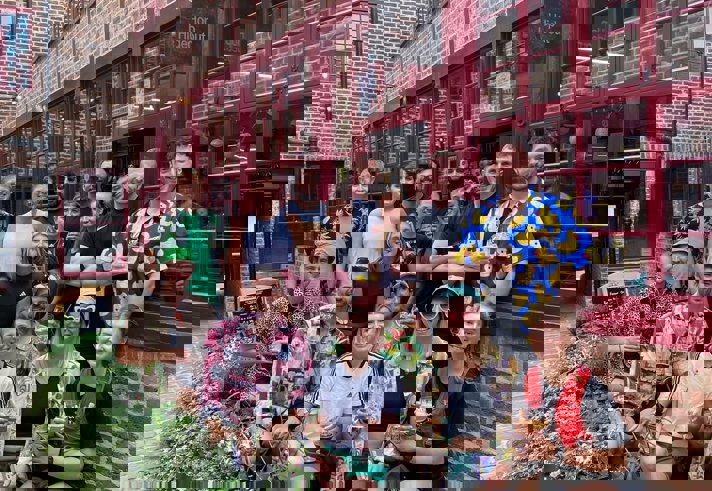 A group of people posing for a photo outside Hop Hideout in Sheffield.
