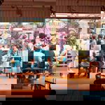 Groups of people sat at tables at Decks.