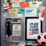 An interior shot of Yard Ball that has been made to look like a public phone booth. There is a pink football on a shelf.