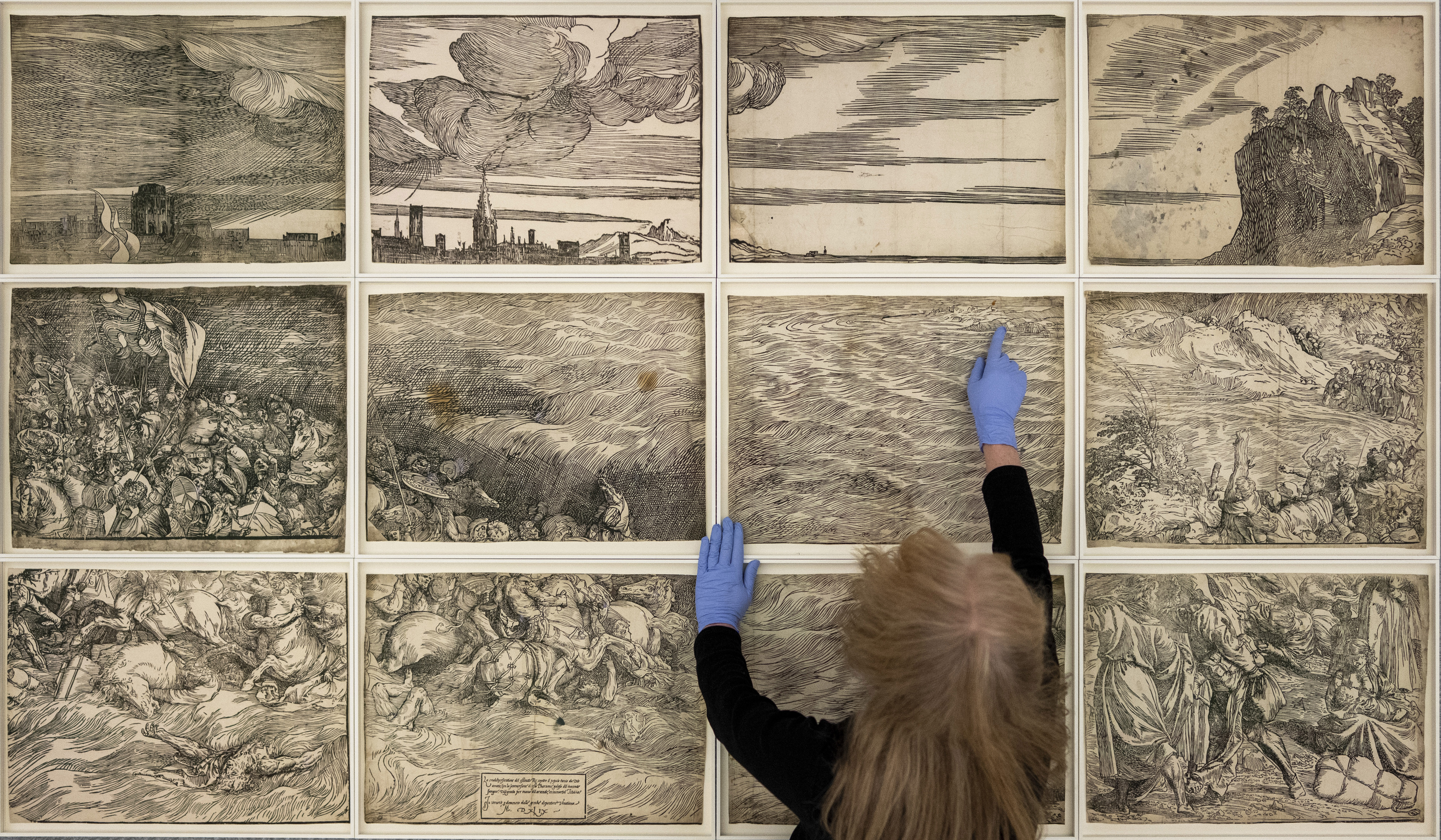 Penny McCarthy with Titian's The Submersion of Pharaoh’s Army in the Red Sea (c. 1549), How to Look Through Time © the artist. Photo: Hugo Glendinning