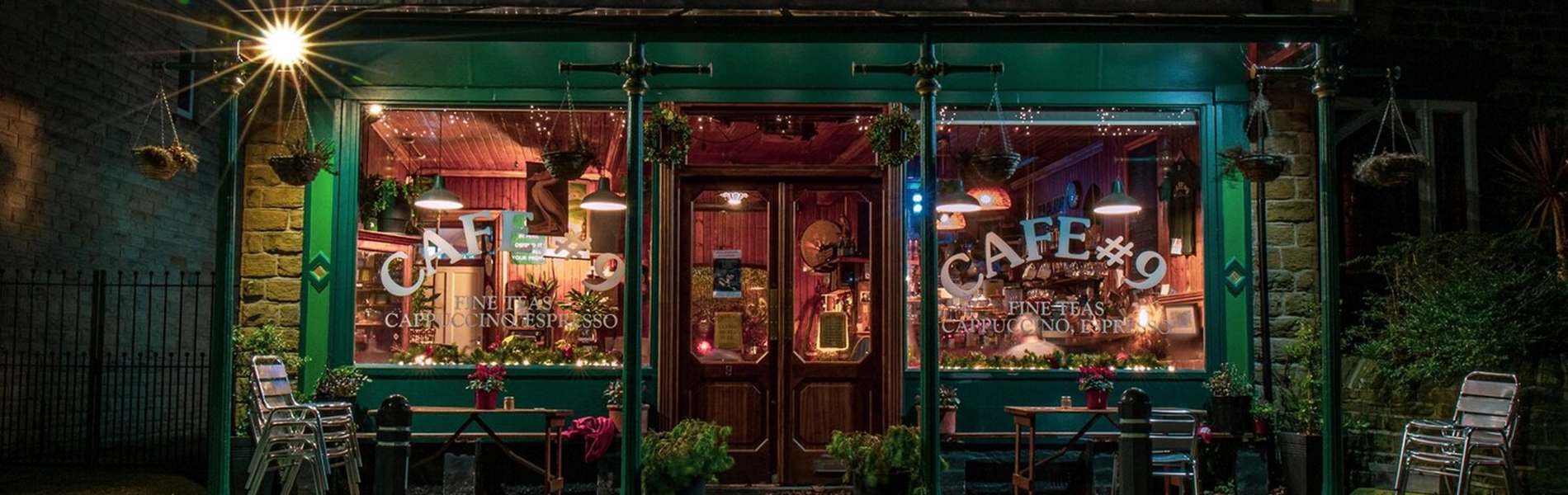 The exterior of Cafe #9 at night.