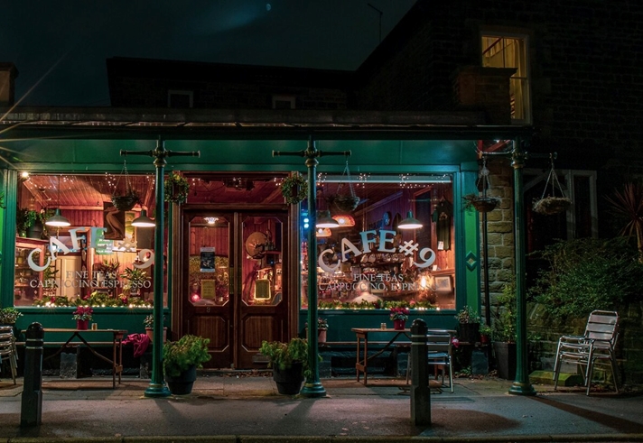 The exterior of Cafe #9 at night.