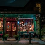 The exterior of Cafe #9 at night.