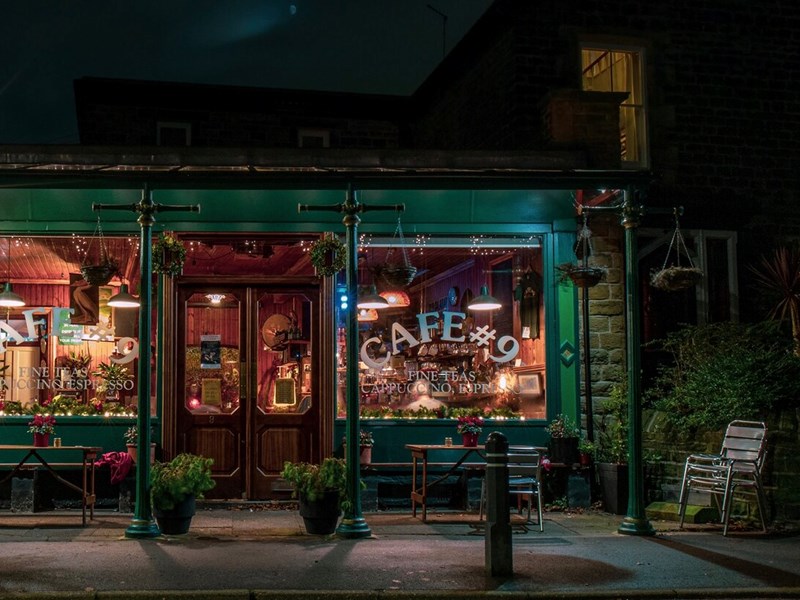 The exterior of Cafe #9 at night.