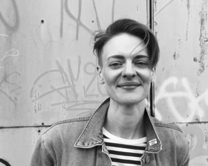 A black and white photo of Finn, who is smiling.