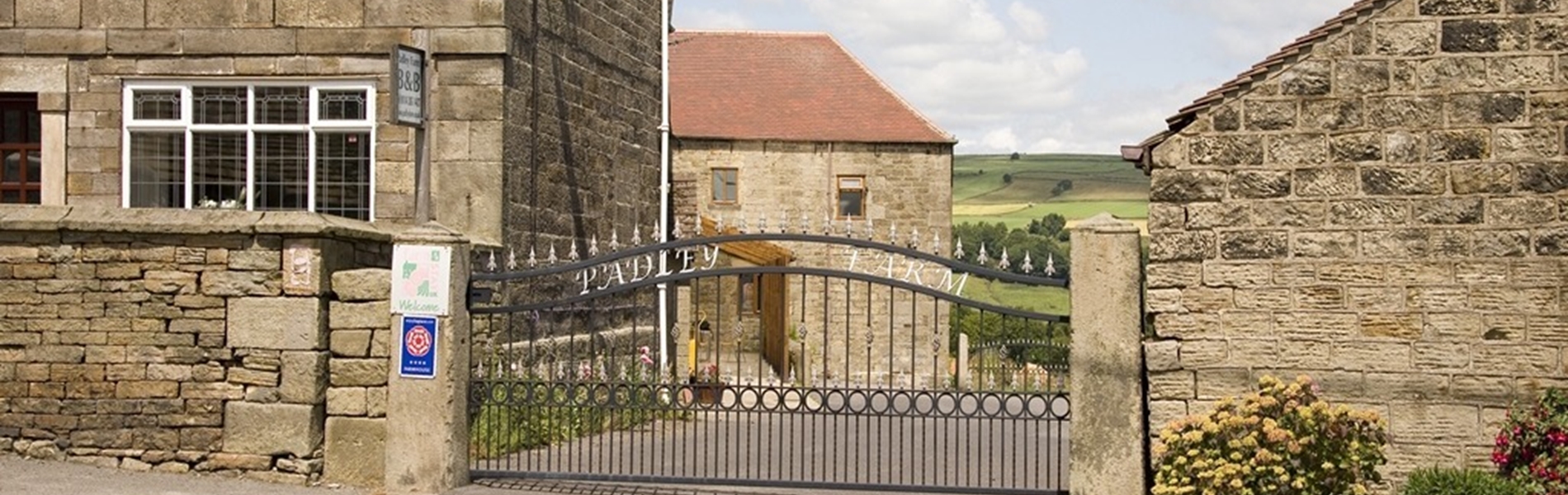 Padley Farm – exterior view with driveway leading to the entrance.
