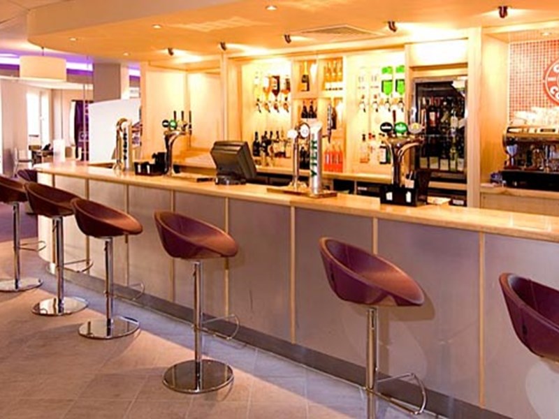 Premier Inn St Mary’s Gate – modern bar area with seating and drinks display