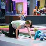 A woman and a small child playing and having fun at Jump Inc.