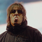 Liam Gallagher sticking his tongue out.