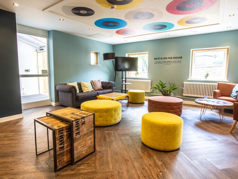 Jonas Court – communal area with seating and open space for residents.