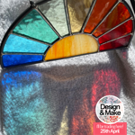 A hand-made stained glass semi circle.