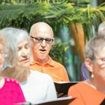 A group of adults singing together.