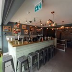 Stools round a bar at Butcher & Catch.