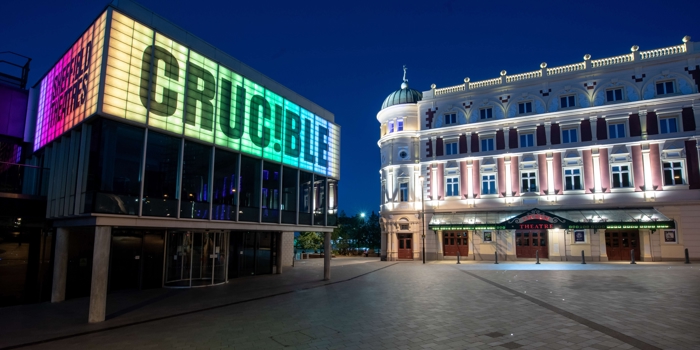 The Crucible Theatre and the Lyceum Theatre lit up at night.