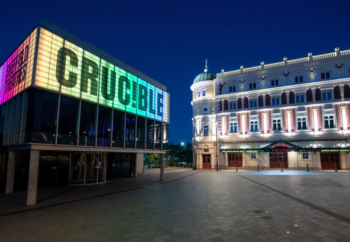The Crucible Theatre and the Lyceum Theatre lit up at night.