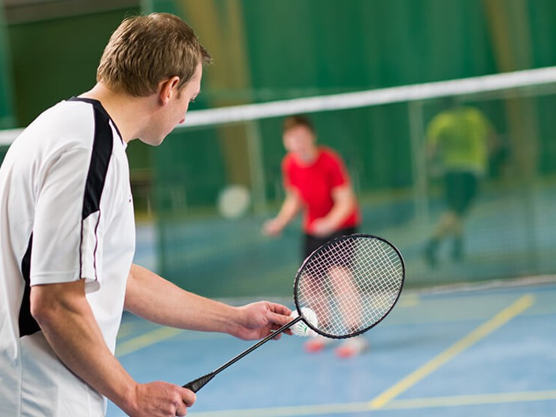 People playing badminton.