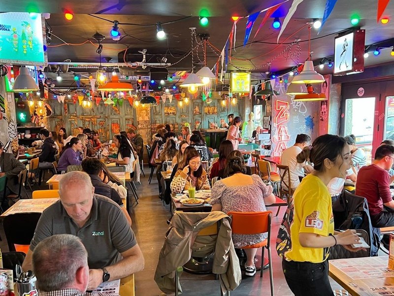 Tables filled with customers at Zaap Thai Street Food.