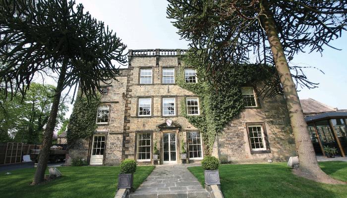 Best Western Plus Mosborough Hall Hotel surrounded by trees and gardens.