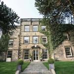 Best Western Plus Mosborough Hall Hotel surrounded by trees and gardens.