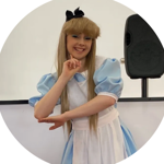 A person dressed as Alice from Alice In Wonderland.