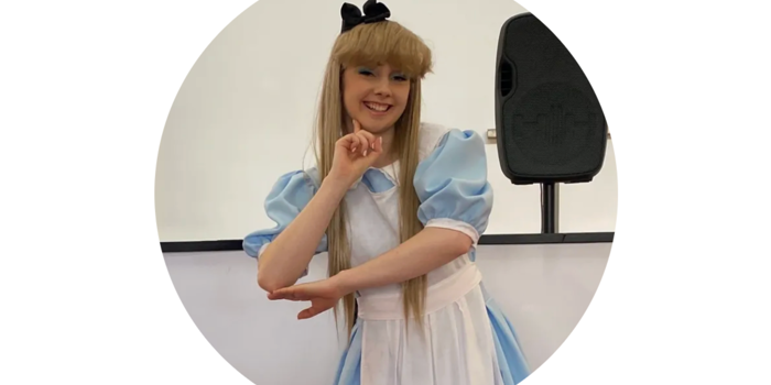 A person dressed as Alice from Alice In Wonderland.