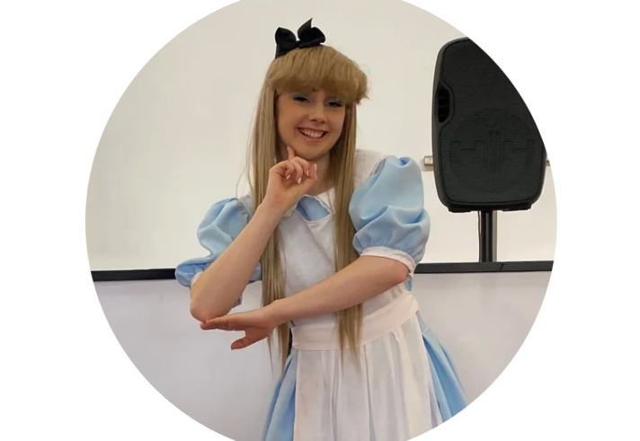 A person dressed as Alice from Alice In Wonderland.
