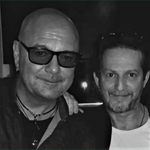A black and white photo of John Reilly and Lewis Nitikman.