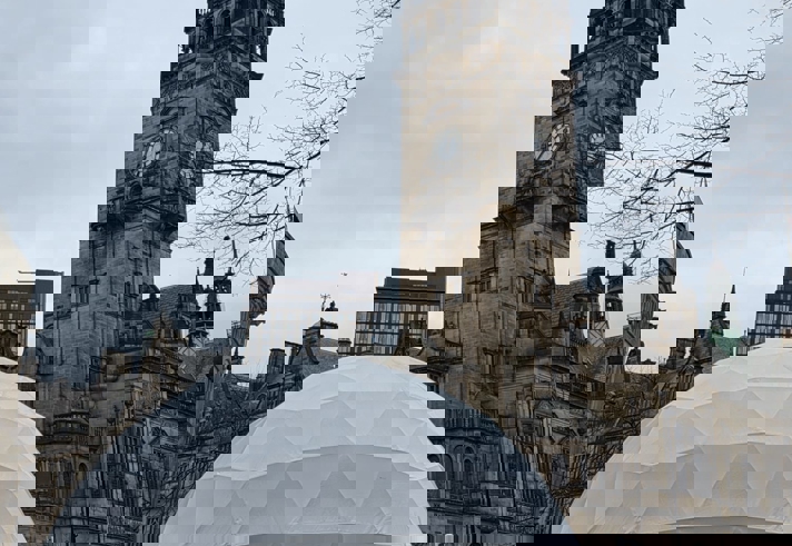 A white domed structure sits at the top end of Fargate in Sheffield.