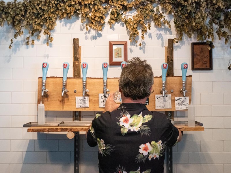 A man pulling a pint at The Brewery of St Mars of the Desert.