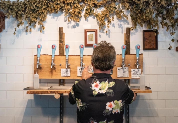 A man pulling a pint at The Brewery of St Mars of the Desert.