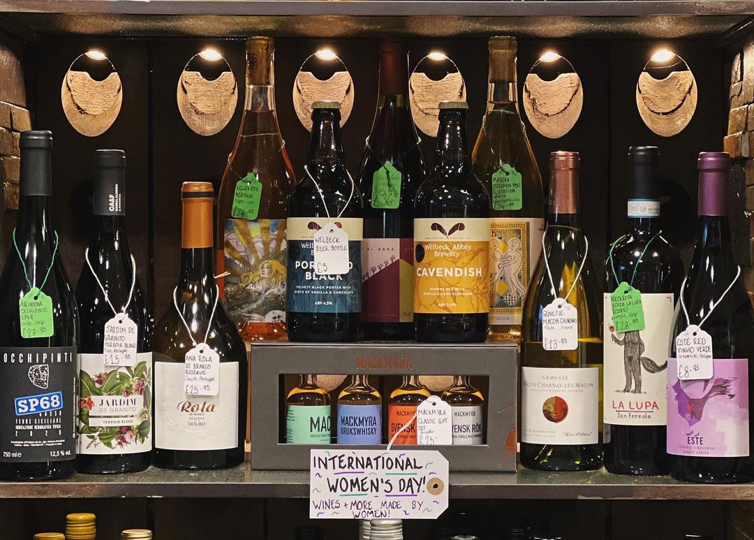 A shelf with various bottles of spirits.