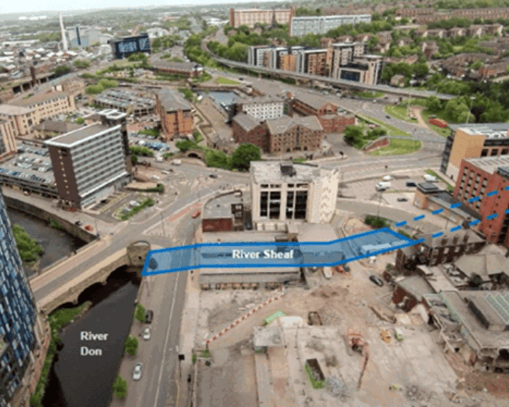 Aerial view of an urban area showing roads, buildings, and rivers in Sheffield. The River Don runs through the bottom left, and the River Sheaf is highlighted in blue as it flows through the city centre. Surrounding the rivers are modern and older buildings, green spaces, and major road junctions