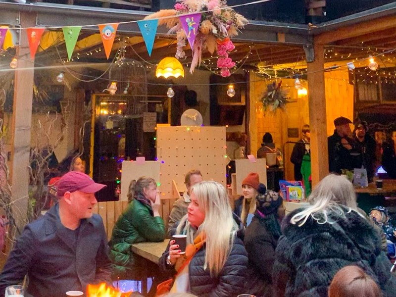 The courtyard at Hagglers Corner, filled with people celebrating.