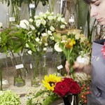 A member of staff arranging flowers at Plantology.