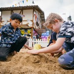 Children playing in a sandpit.